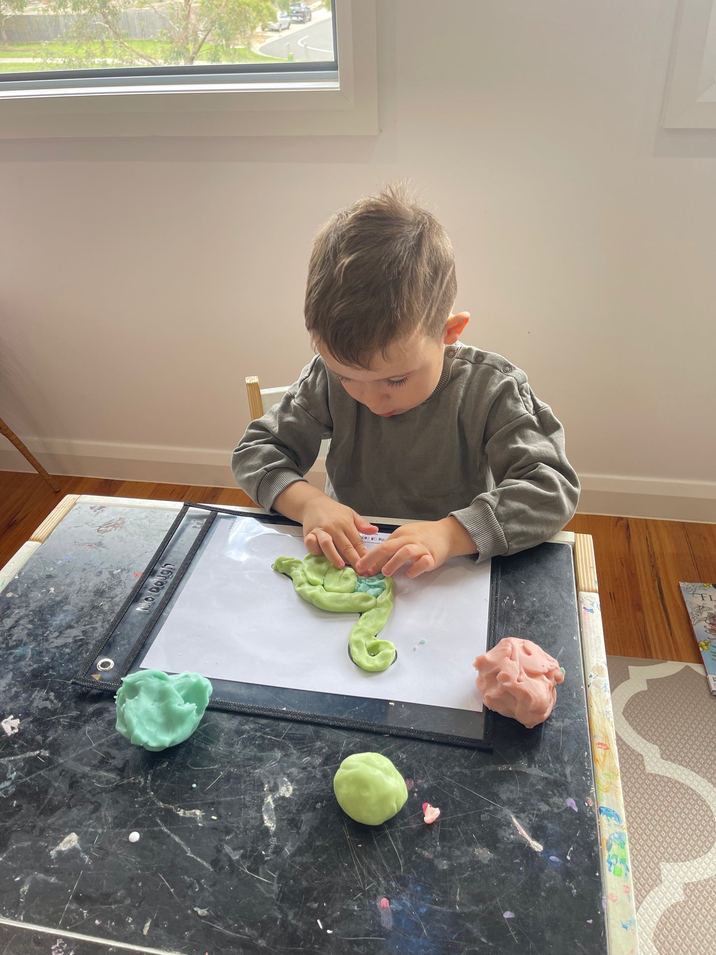 Kids playing with Bio DoUgh Pocket Sleeves using colourful dough