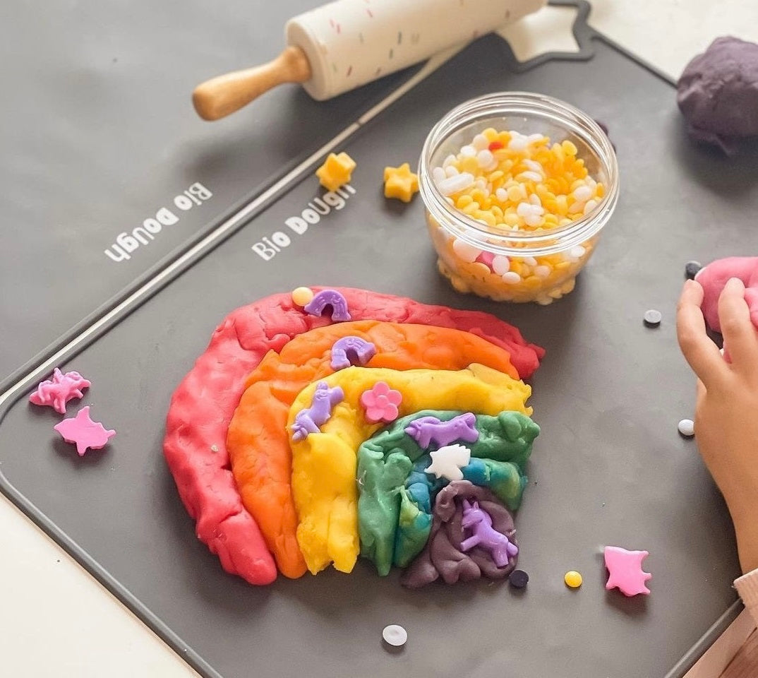 Colourful Bio DoUgh rainbow creation on a branded play mat