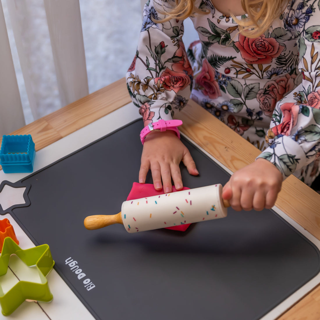 Child using a Bio DoUgh rolling pin during fine motor play