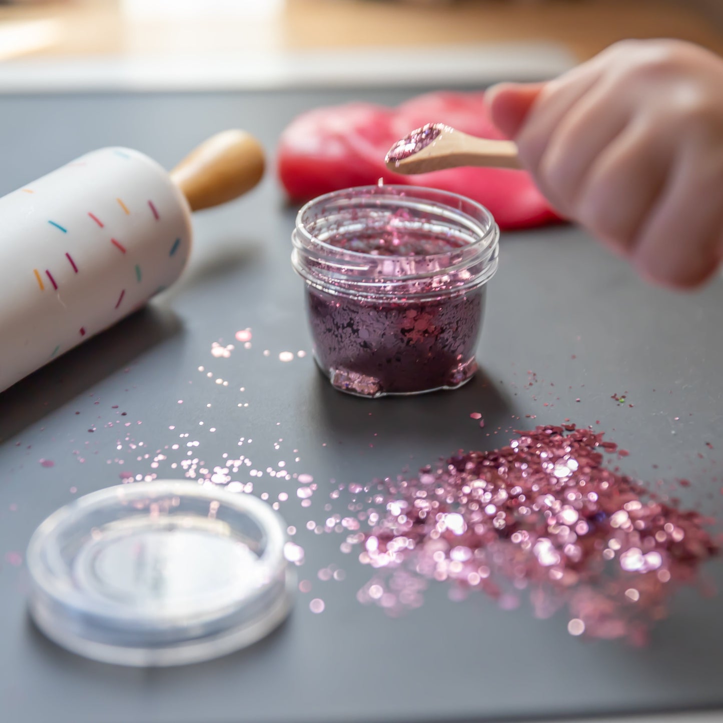 Close-up of dusty pink glitter Bio DoUgh showing sparkly texture