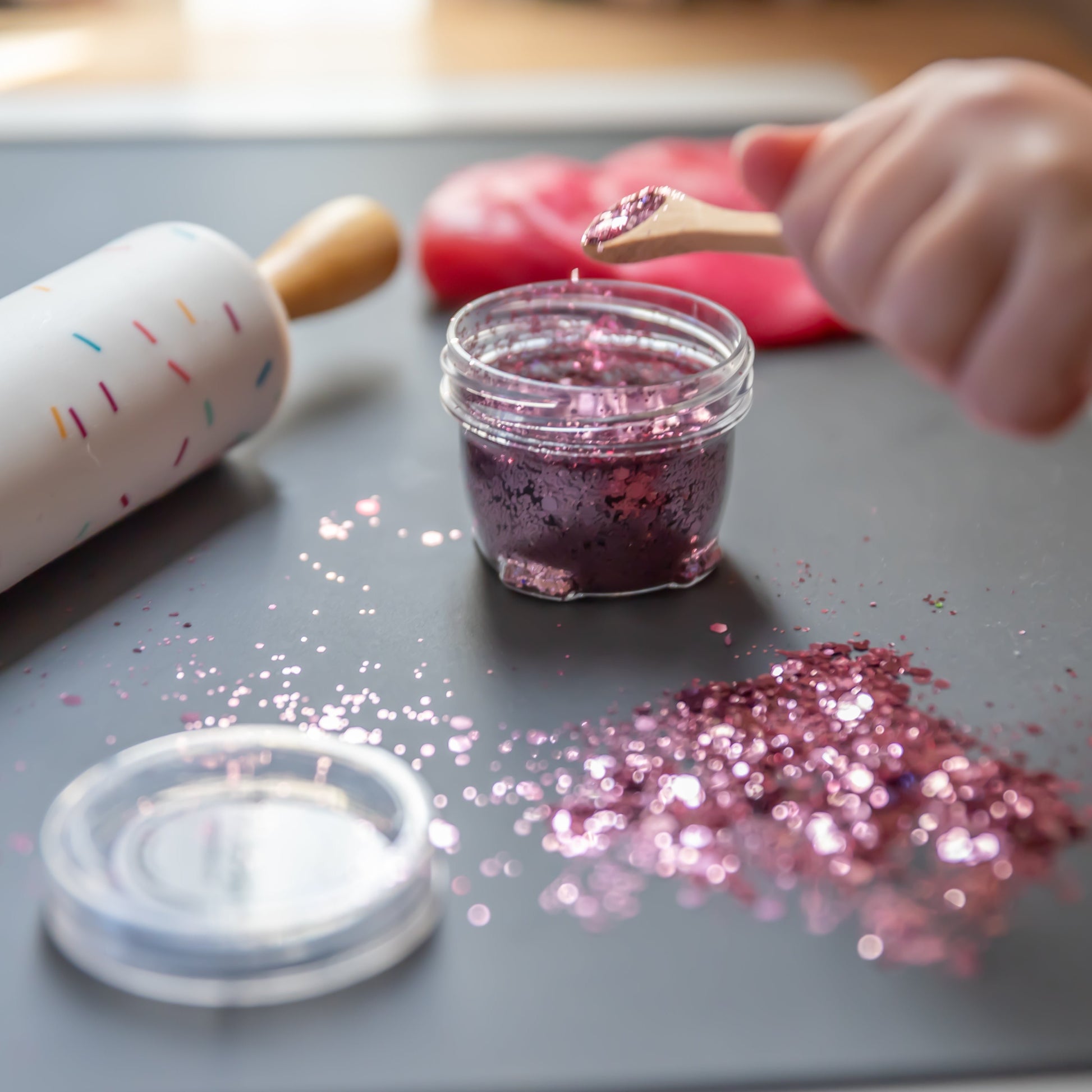 Close-up of dusty pink glitter Bio DoUgh showing sparkly texture