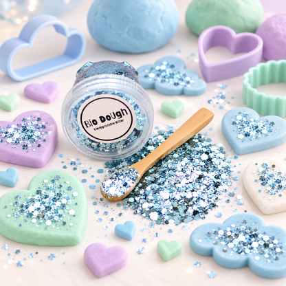 Blue biodegradable glitter with Bio DoUgh playdough shapes and colourful sensory play tools