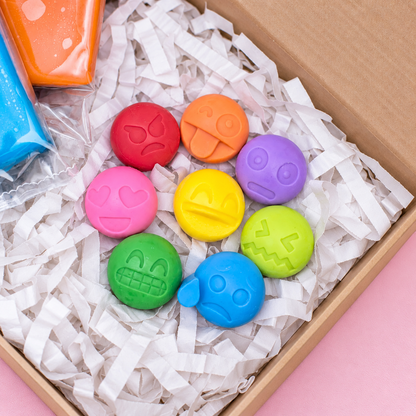 Colourful Emotion Emoji figurines arranged in a Bio DoUgh sensory play gift box