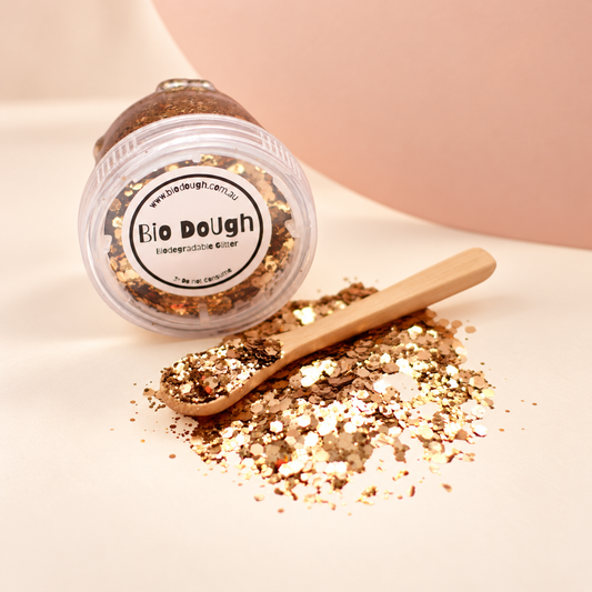 Golden biodegradable Bio DoUgh glitter with bamboo spoon for playdough and sensory play