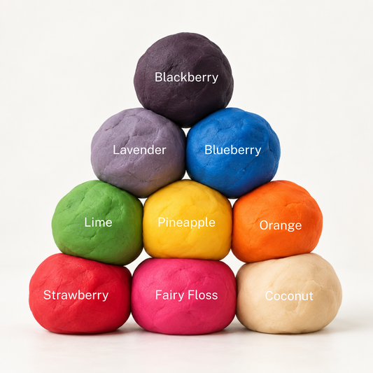 A pyramid of colorful fruit-flavored gum balls labeled with names like Blackberry, Lavender, Blueberry, Lime, Pineapple, Orange, Strawberry, Fairy Floss, and Coconut on a clean white background.