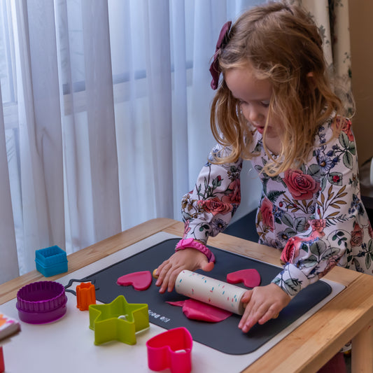 Child using Bio DoUgh Rolling Pin with Confetti Design and Wooden Handles