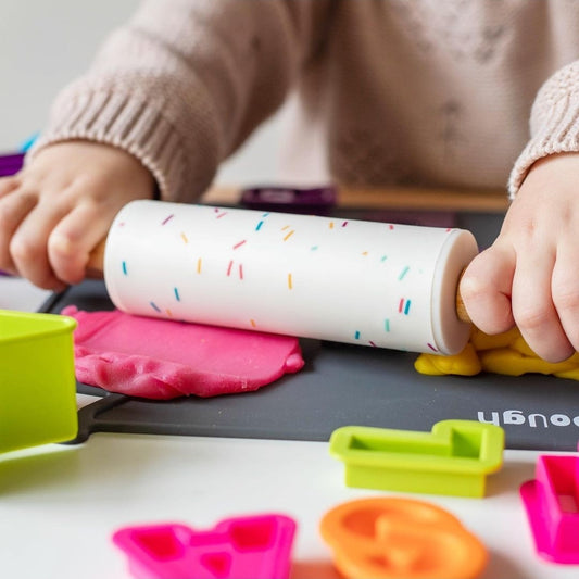 Child using Bio DoUgh Rolling Pin with Confetti Design and Wooden Handles